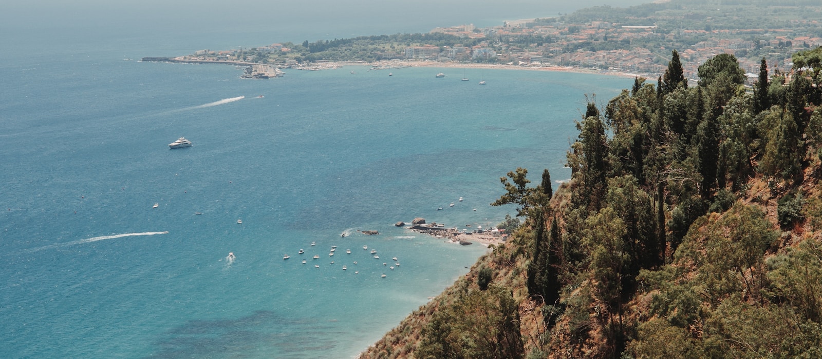 Sunlit Mediterranean coastline and blue sea